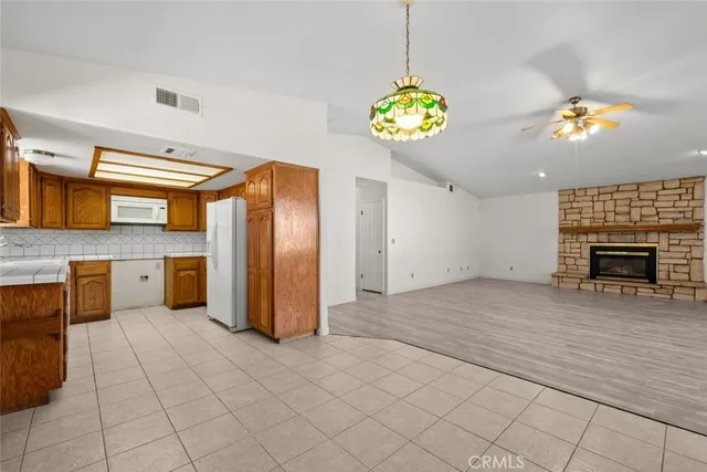 a view of a kitchen with a sink and a chandelier