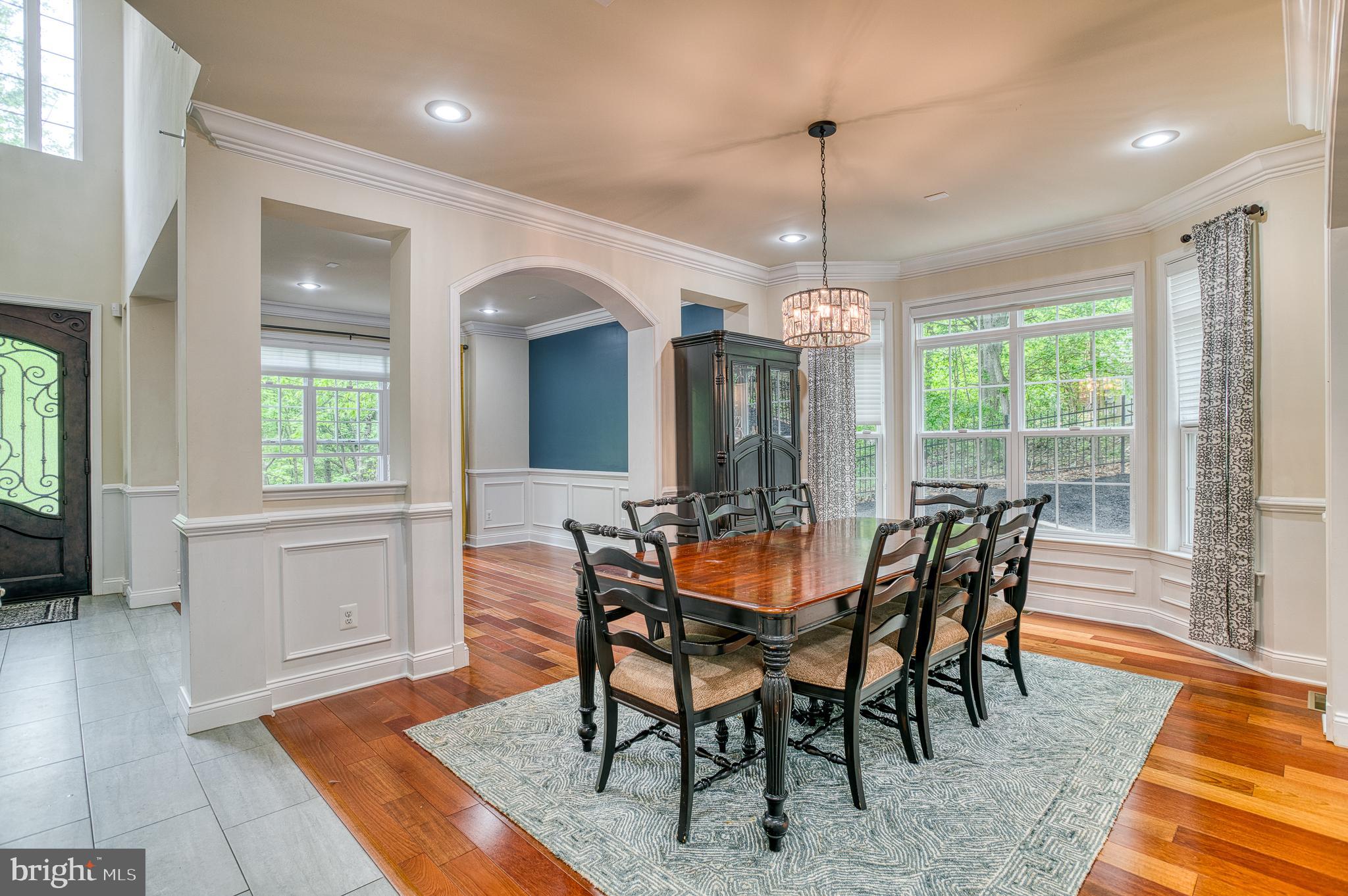 7140 Barry Road Alexandria, VA 22315 - Photo 13 of 56 a dining room with furniture window wooden floor