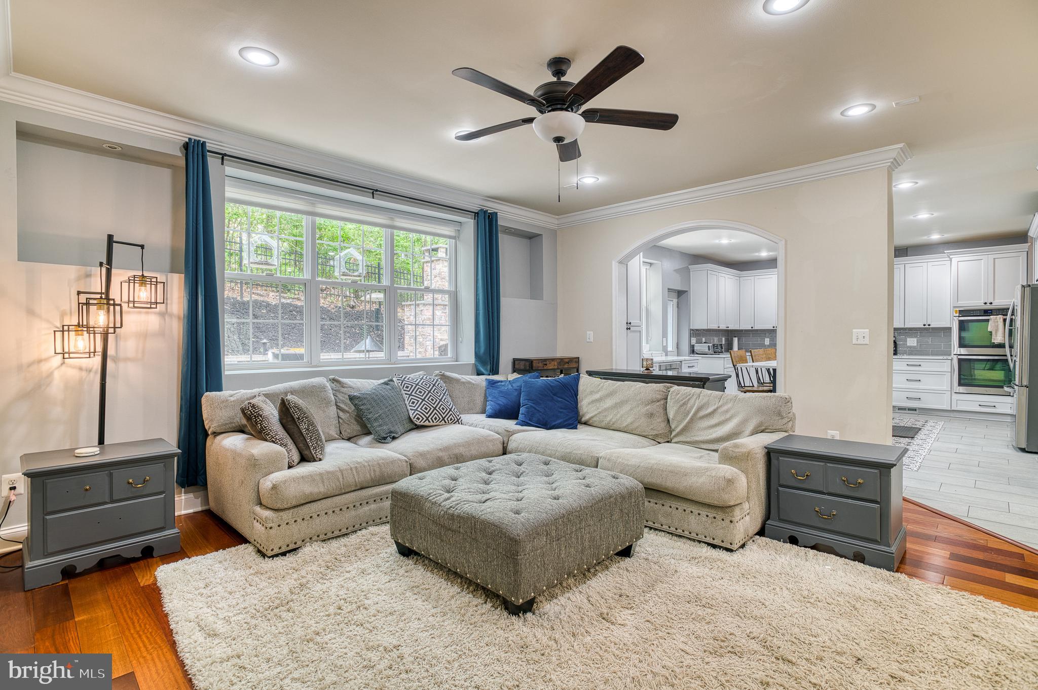 7140 Barry Road Alexandria, VA 22315 - Photo 15 of 56 a living room with furniture and a large window