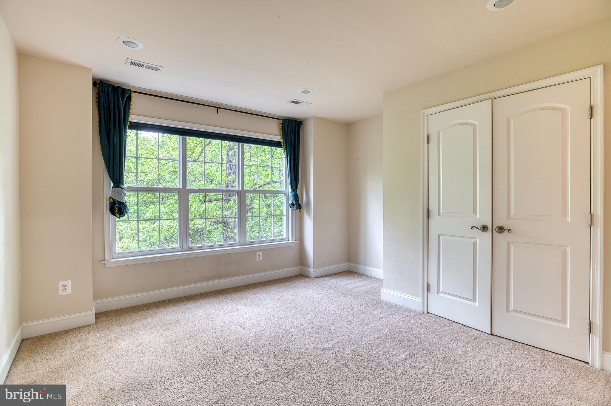 7140 Barry Road Alexandria, VA 22315 - Photo 30 of 56 a view of an empty room with a window
