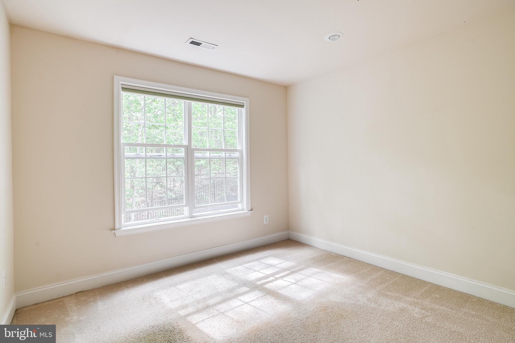 7140 Barry Road Alexandria, VA 22315 - Photo 33 of 56 an empty room with a window