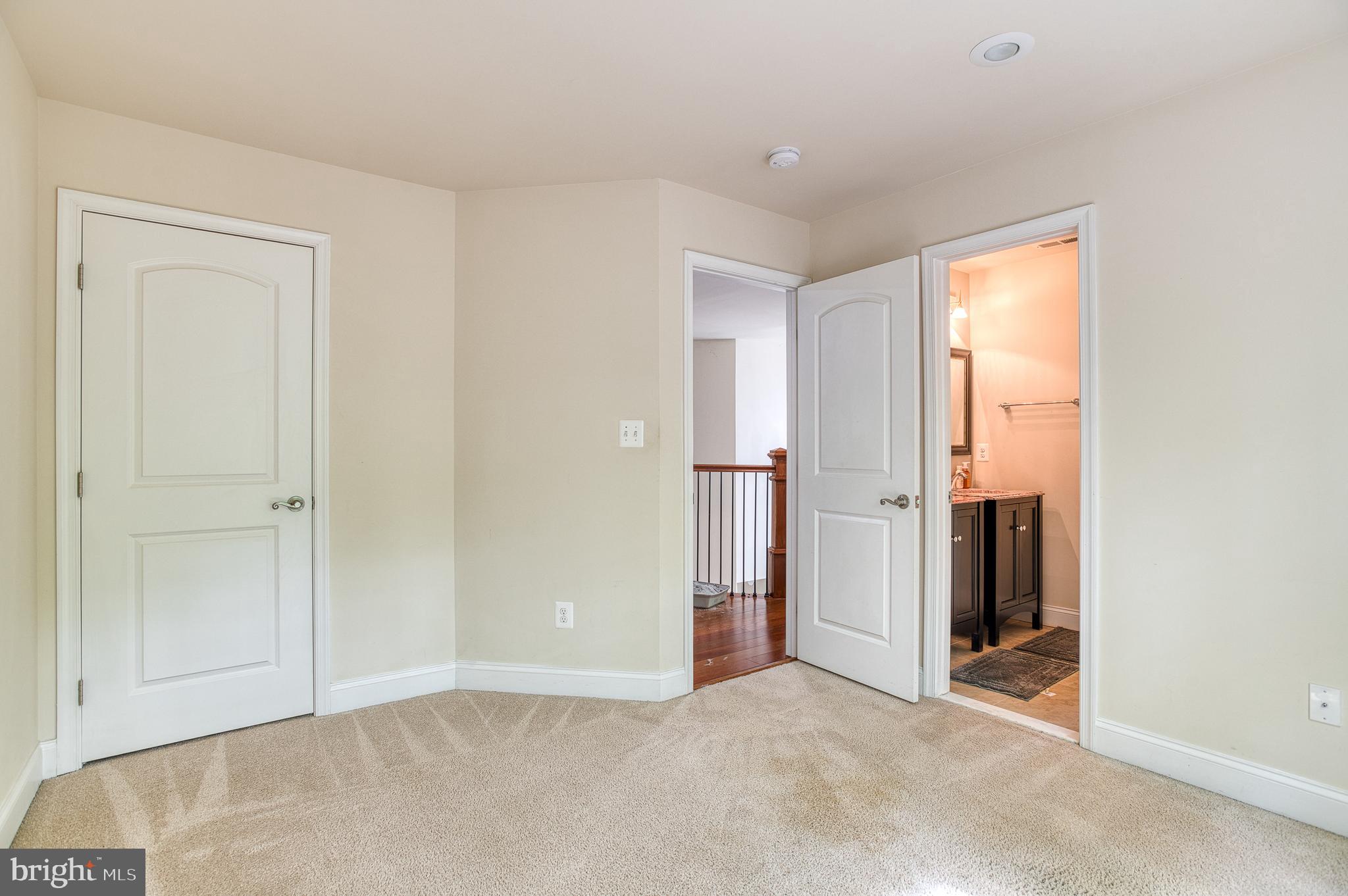 7140 Barry Road Alexandria, VA 22315 - Photo 34 of 56 a view of an empty room with closet and a window