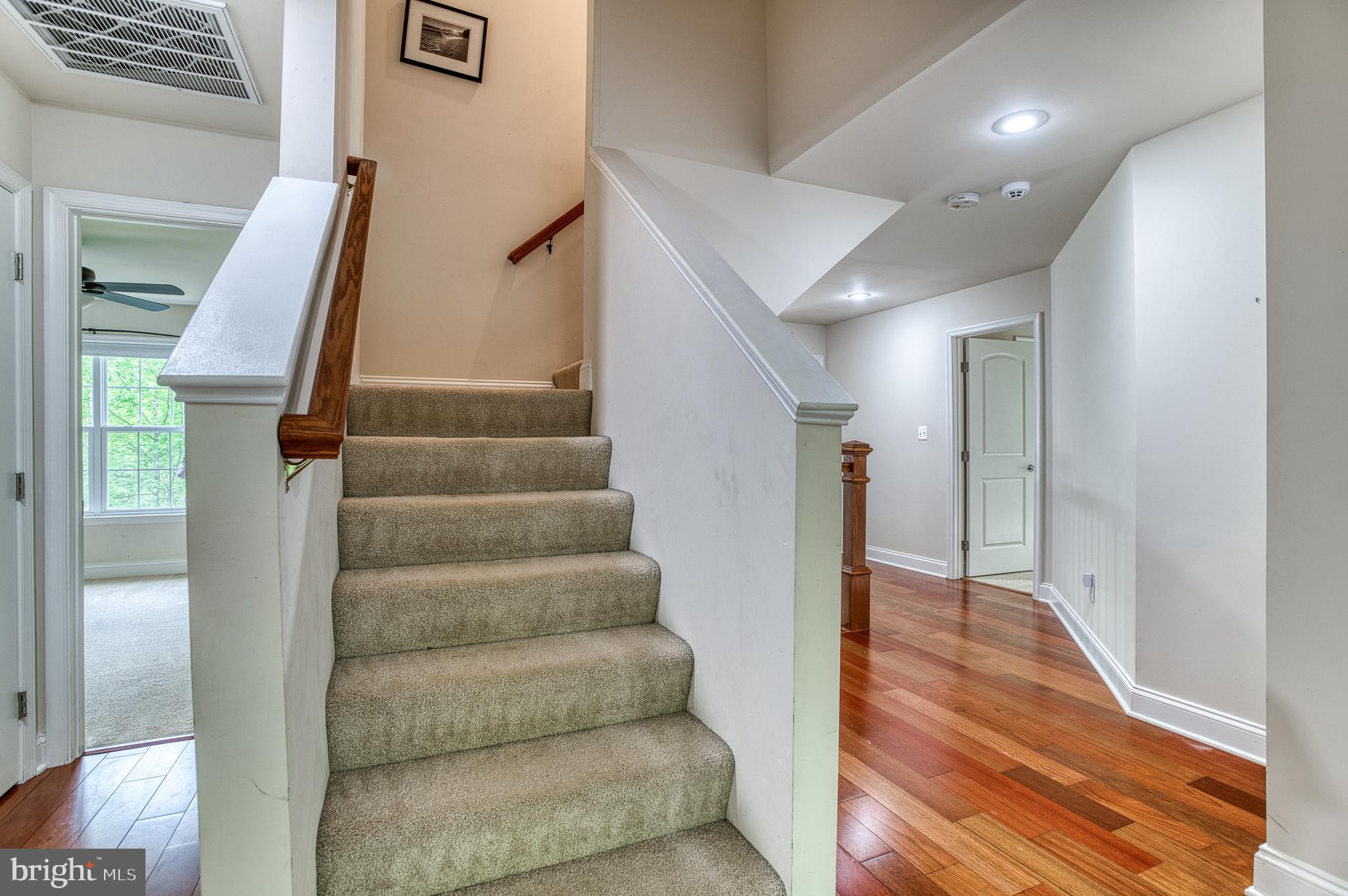 7140 Barry Road Alexandria, VA 22315 - Photo 38 of 56 a view of entryway and hall with wooden floor