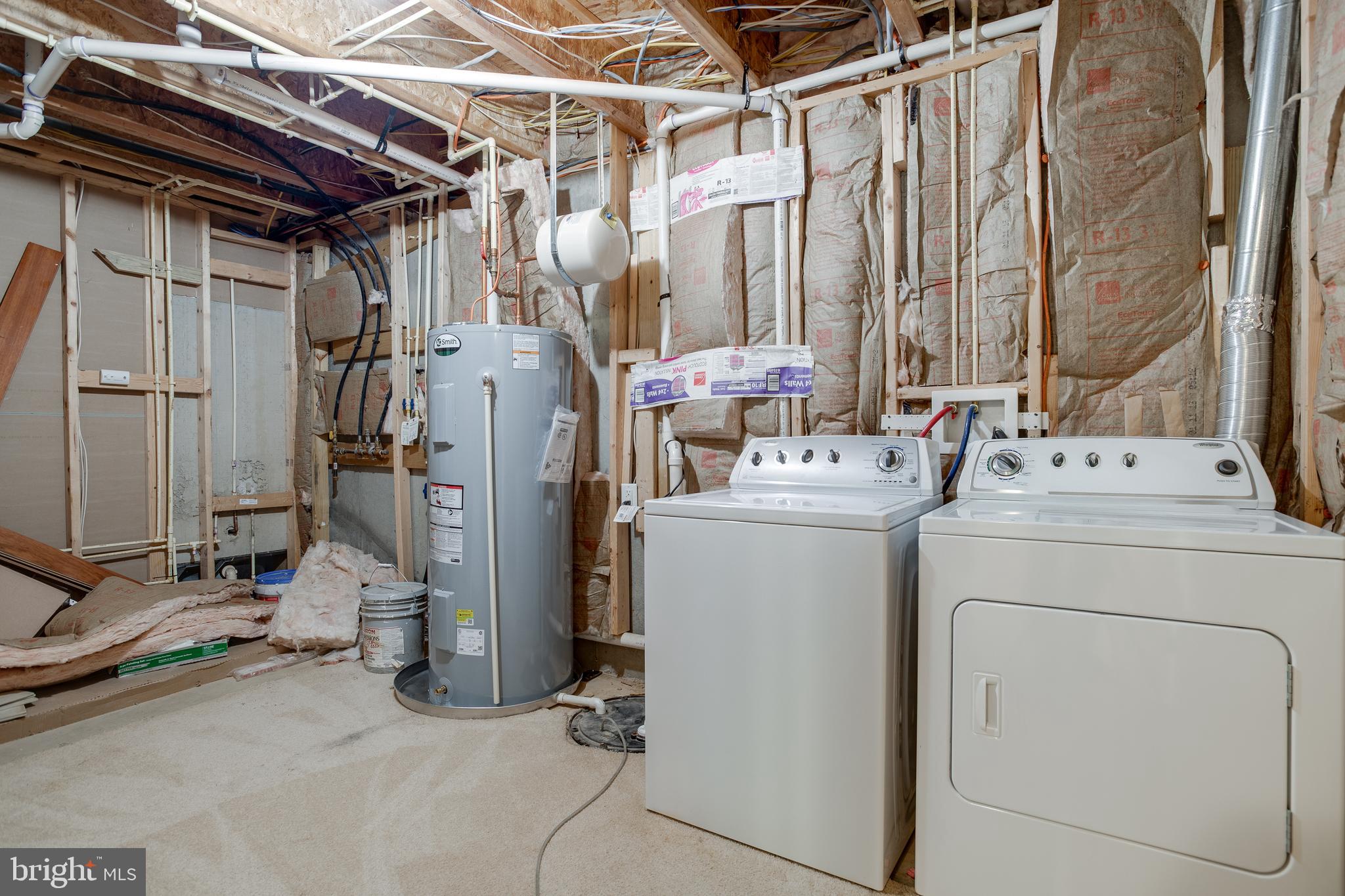 7140 Barry Road Alexandria, VA 22315 - Photo 48 of 56 a utility room with dryer and washer