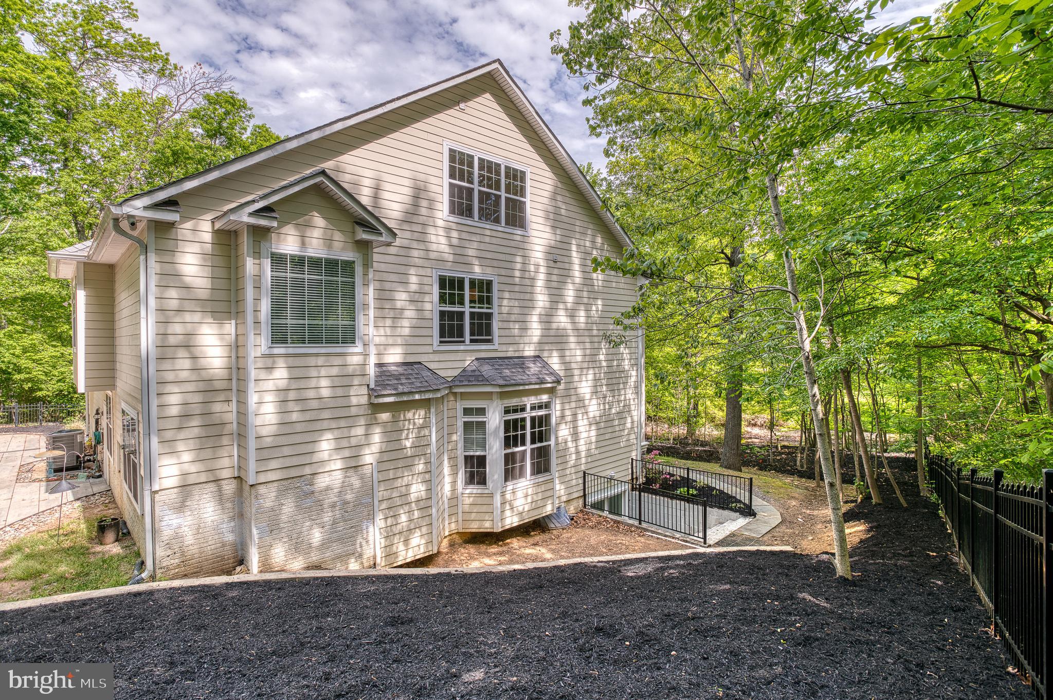 7140 Barry Road Alexandria, VA 22315 - Photo 49 of 56 a view of a house with a yard