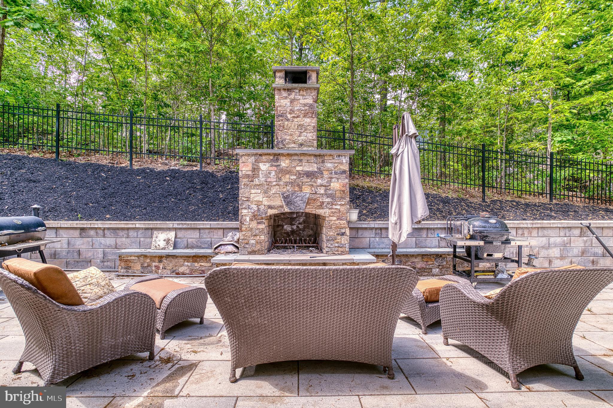 7140 Barry Road Alexandria, VA 22315 - Photo 51 of 56 a view of a patio with couches and potted plants