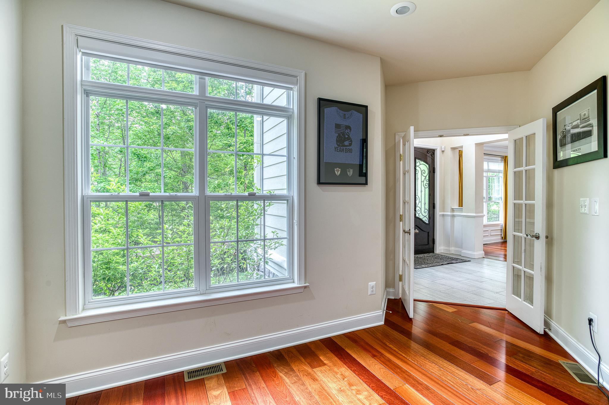 7140 Barry Road Alexandria, VA 22315 - Photo 10 of 56 a view of hallway with a large window and wooden floor