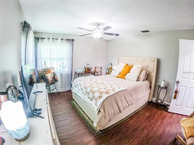 a bedroom with bed and window