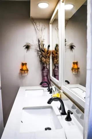 a bathroom with a tub and sink