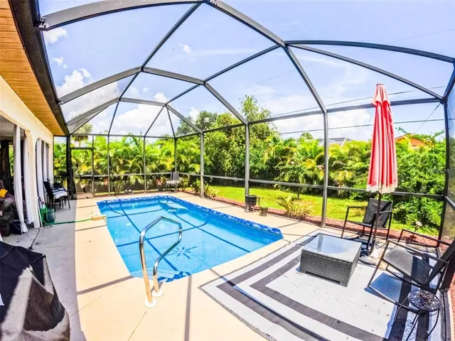 a view of swimming pool with patio