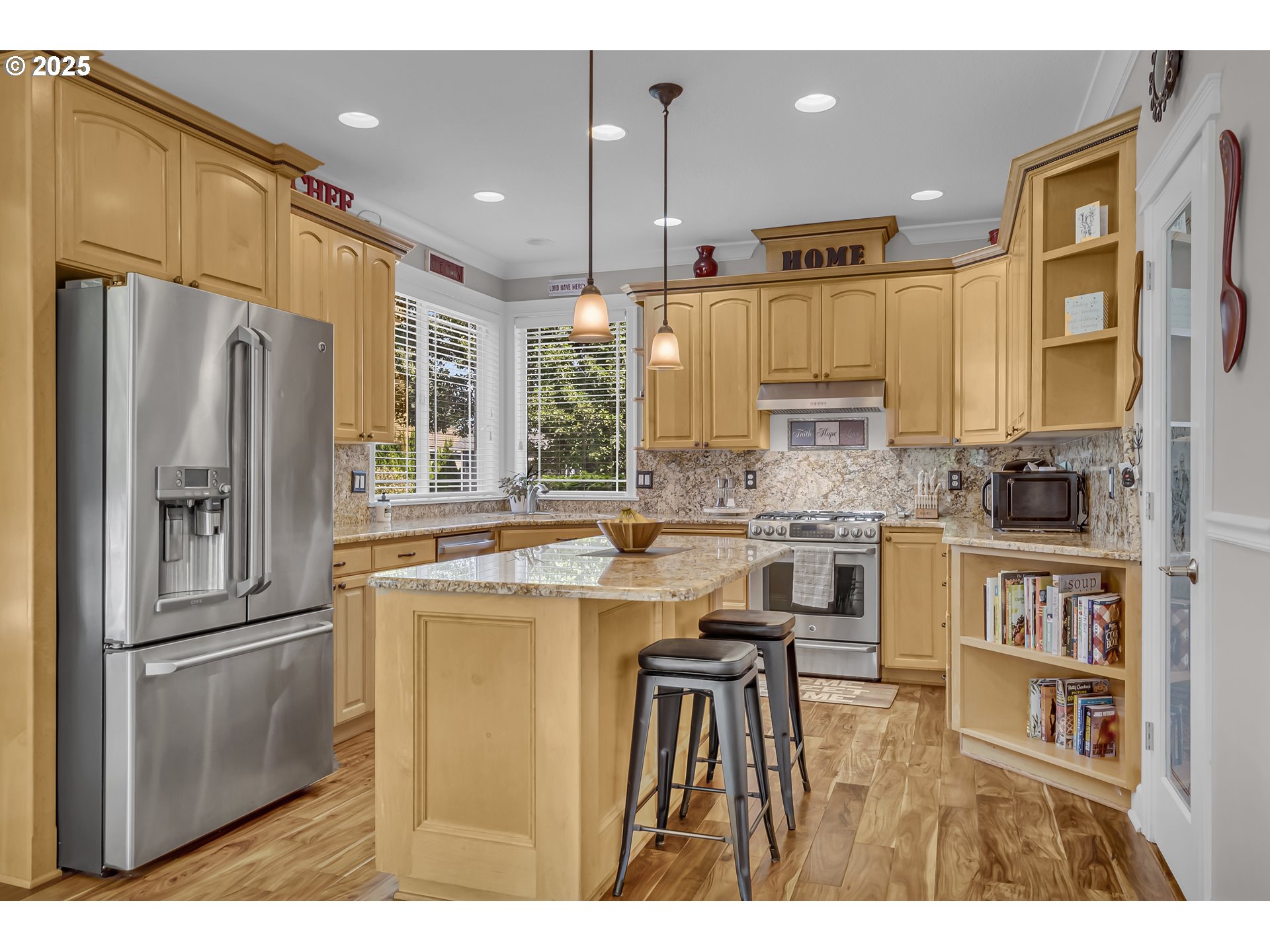 6336 Nicklaus Loop North Keizer, OR 97303 - Photo 13 of 45 a kitchen with stainless steel appliances granite countertop a refrigerator a stove and a sink