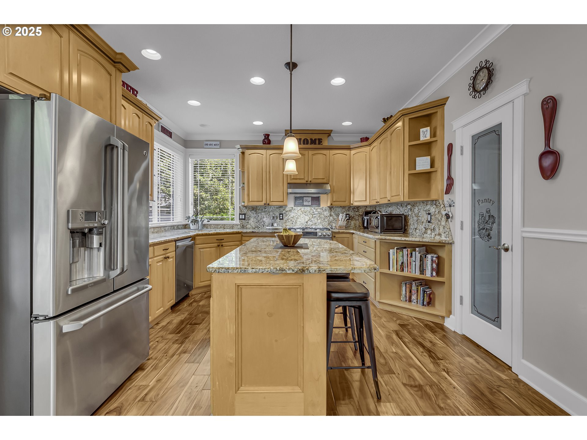 6336 Nicklaus Loop North Keizer, OR 97303 - Photo 14 of 45 a kitchen with stainless steel appliances granite countertop a refrigerator a stove and a sink