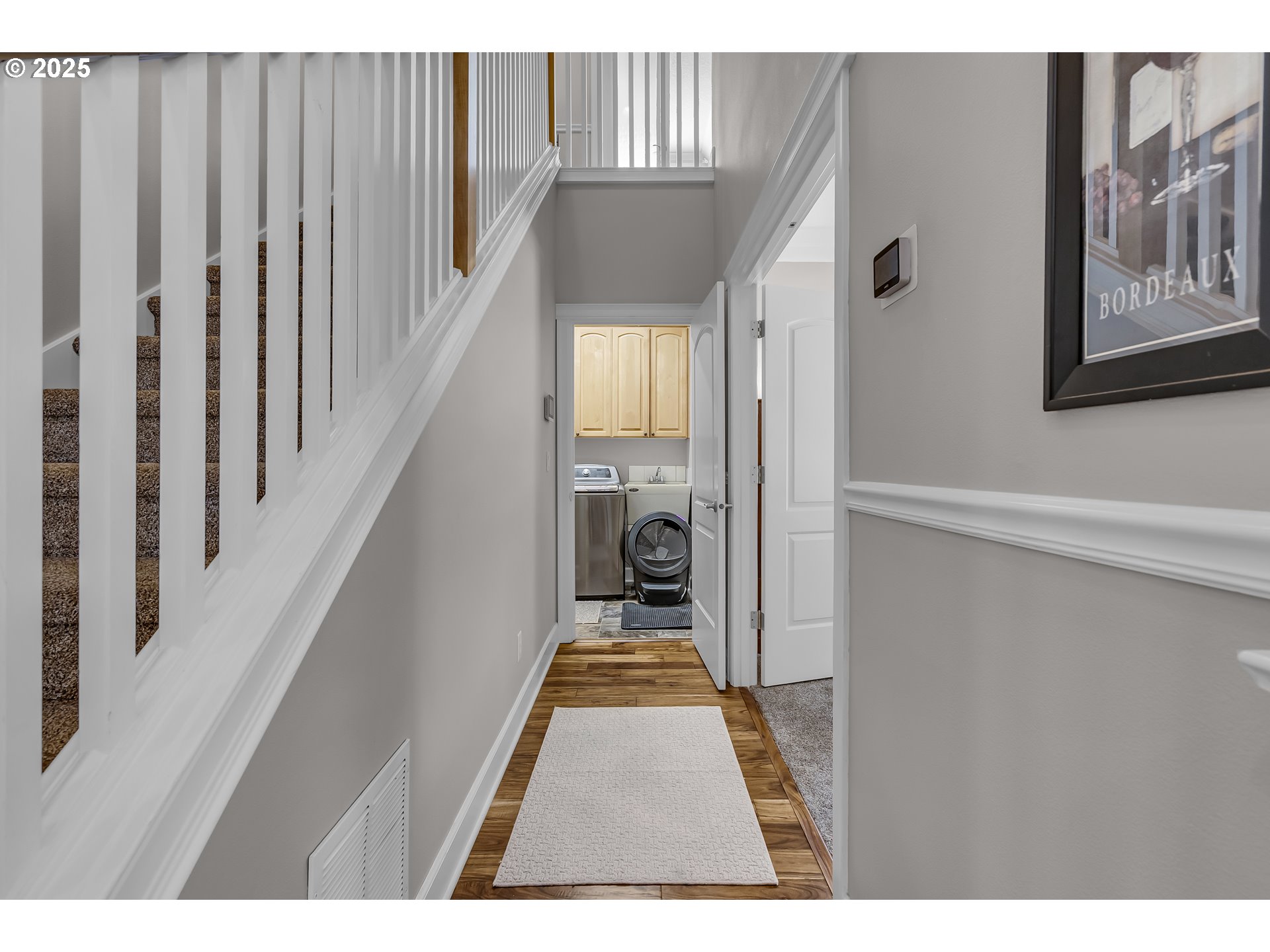 6336 Nicklaus Loop North Keizer, OR 97303 - Photo 18 of 45 a view of a hallway with wooden floor and staircase