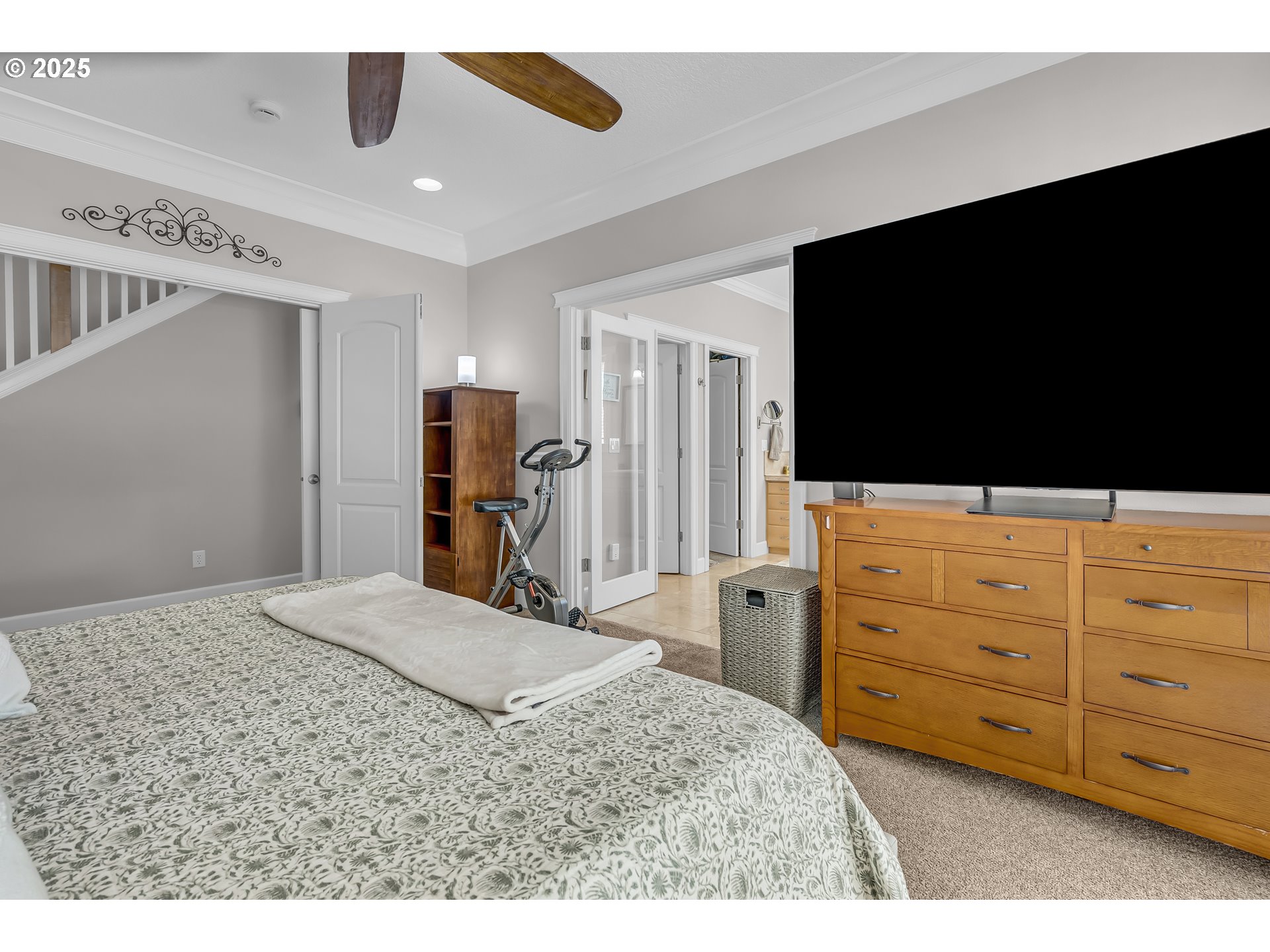 6336 Nicklaus Loop North Keizer, OR 97303 - Photo 20 of 45 a bedroom with a bed and a flat tv screen on dresser