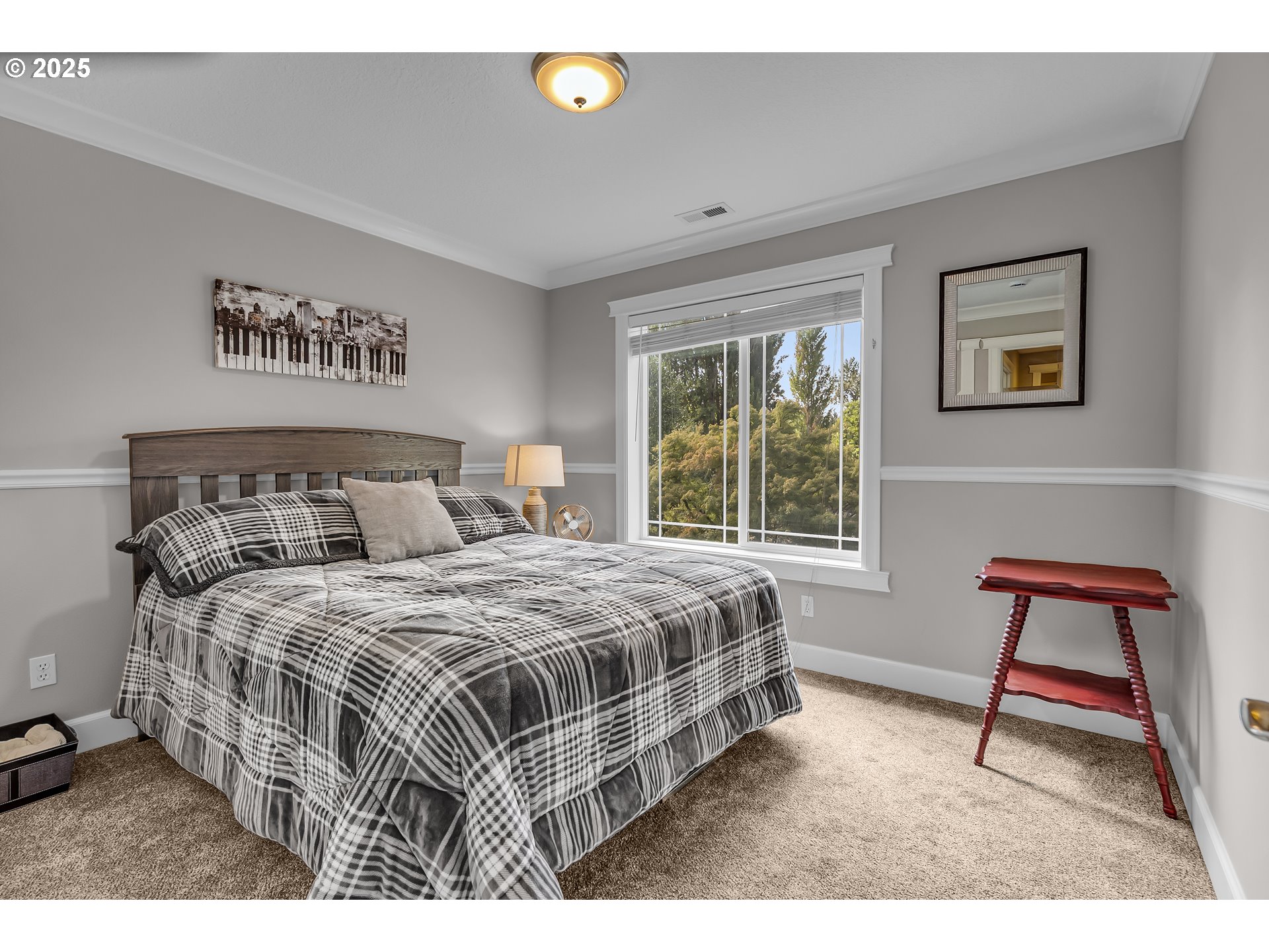 6336 Nicklaus Loop North Keizer, OR 97303 - Photo 28 of 45 a bedroom with a bed a rug and a window