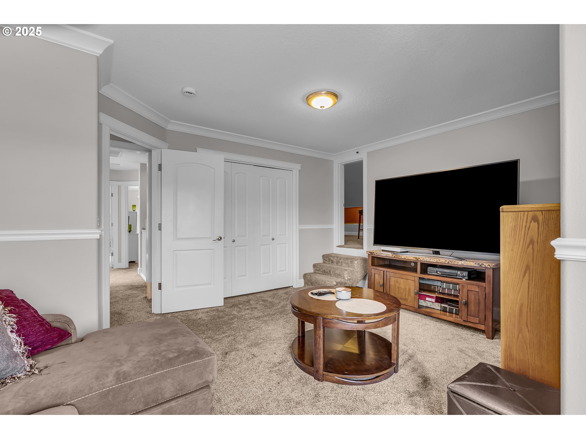 6336 Nicklaus Loop North Keizer, OR 97303 - Photo 32 of 45 a living room with furniture and a flat screen tv