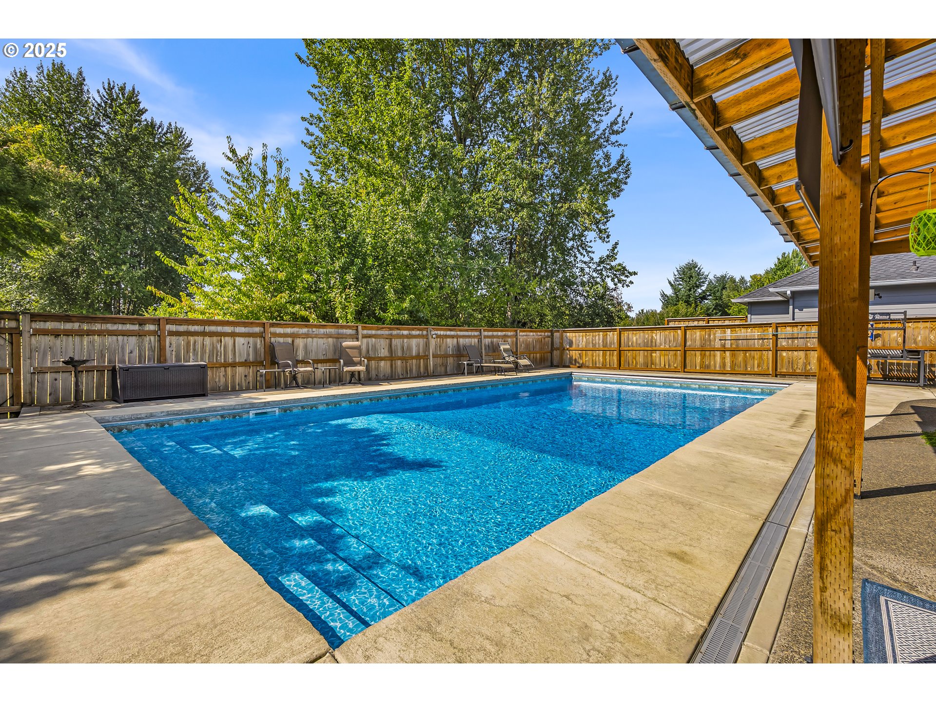6336 Nicklaus Loop North Keizer, OR 97303 - Photo 39 of 45 a view of a swimming pool with a patio and a yard