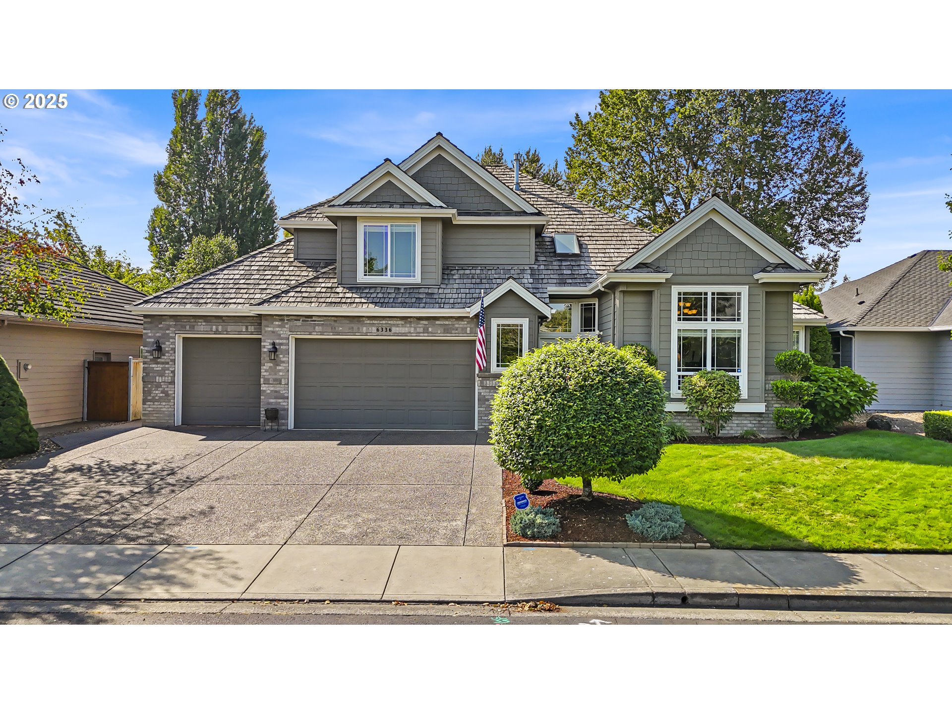 6336 Nicklaus Loop North Keizer, OR 97303 - Photo 44 of 45 a front view of a house with a yard and garage