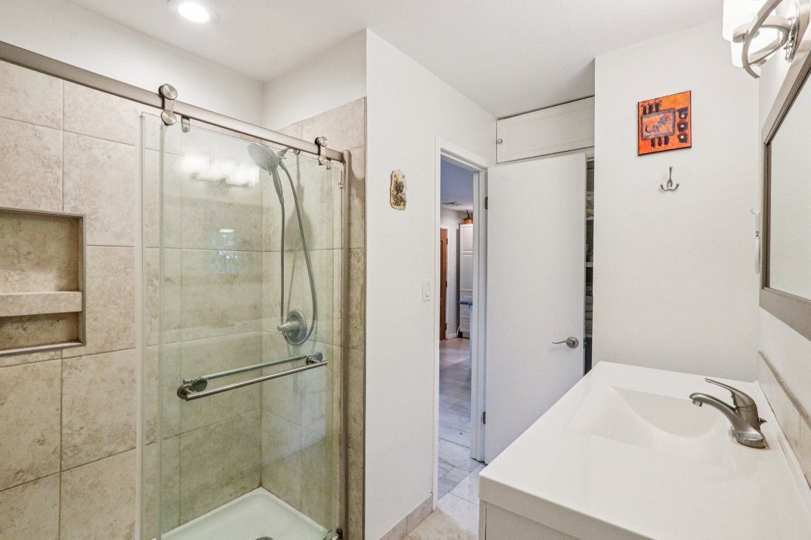 428 Gotier Trace Road Smithville, TX 78957 - Photo 17 of 40 Full bathroom with a shower stall, vanity, and recessed lighting
