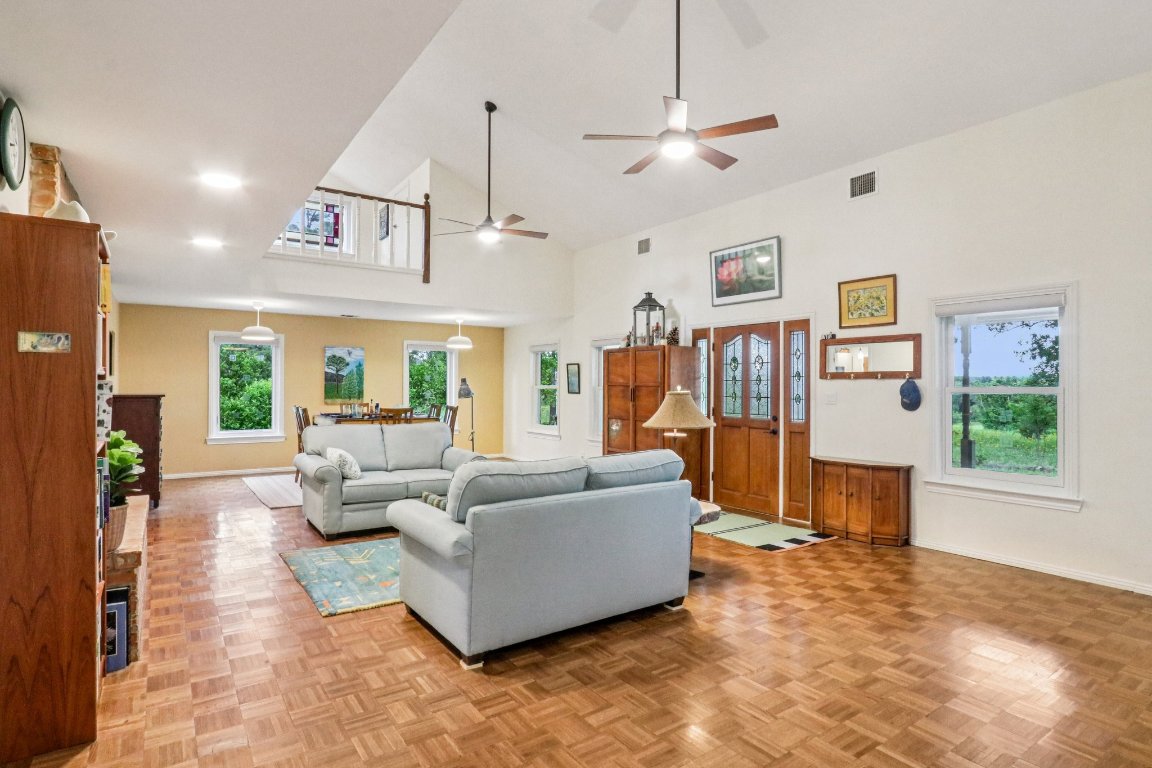 428 Gotier Trace Road Smithville, TX 78957 - Photo 7 of 40 Living area with ceiling fan and high vaulted ceiling