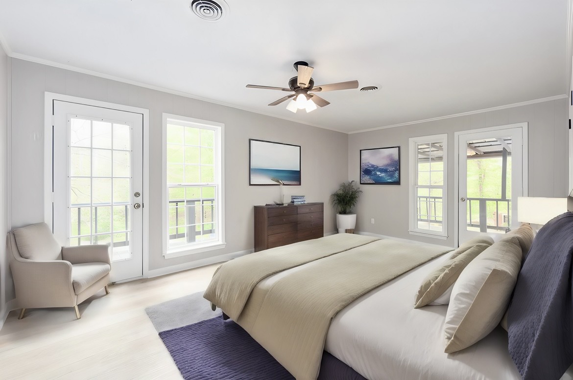 86 Lohrig Road Jackson, TN 38301 - Photo 28 of 58 a bedroom with a large bed couch and a window