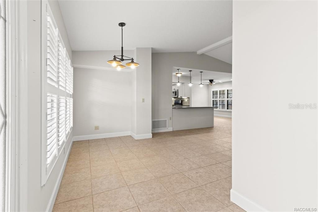 8801 East Cresco Lane Inverness, FL 34450 - Photo 12 of 51 a view of a room with a chandelier