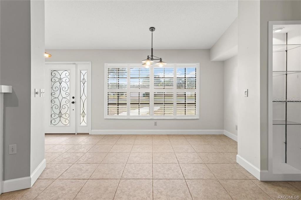 8801 East Cresco Lane Inverness, FL 34450 - Photo 13 of 51 a view of an empty room with a window