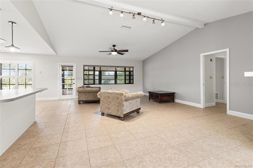 8801 East Cresco Lane Inverness, FL 34450 - Photo 16 of 51 a spacious bedroom with a bed and window