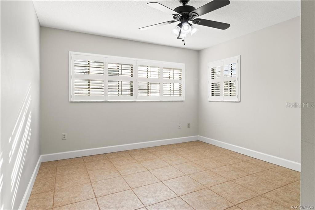8801 East Cresco Lane Inverness, FL 34450 - Photo 20 of 51 a view of an empty room with a window