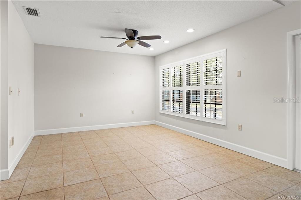 8801 East Cresco Lane Inverness, FL 34450 - Photo 23 of 51 a view of an empty room with a window