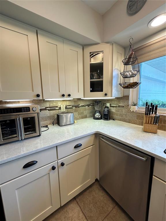 8801 East Cresco Lane Inverness, FL 34450 - Photo 32 of 51 a kitchen with stainless steel appliances granite countertop a sink and a microwave