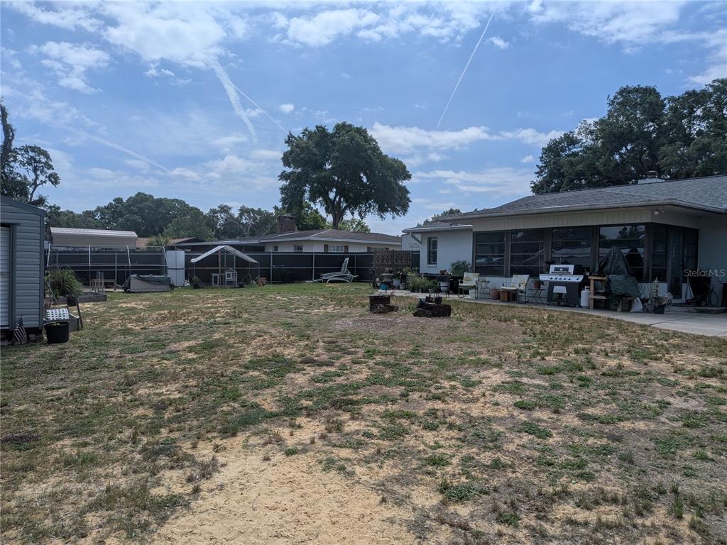 8801 East Cresco Lane Inverness, FL 34450 - Photo 47 of 51 a view of a yard with cars