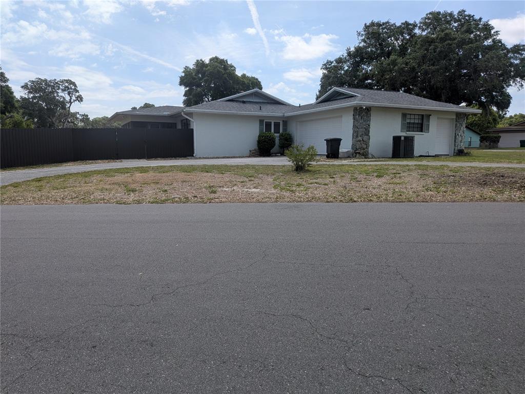 8801 East Cresco Lane Inverness, FL 34450 - Photo 6 of 51 a front view of a house with a yard