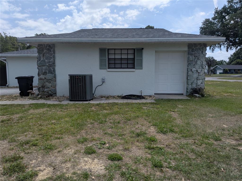 8801 East Cresco Lane Inverness, FL 34450 - Photo 8 of 51 a front view of a house with a yard