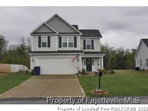 546 Cape Fear Road Raeford, NC 28376 - Photo 1 of 13 a view of a yard in front of a house with a yard