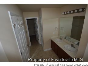 546 Cape Fear Road Raeford, NC 28376 - Photo 11 of 13 a bathroom with a sink and mirror