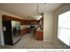 546 Cape Fear Road Raeford, NC 28376 - Photo 4 of 13 a kitchen with stainless steel appliances granite countertop a refrigerator a sink a stove and a refrigerator