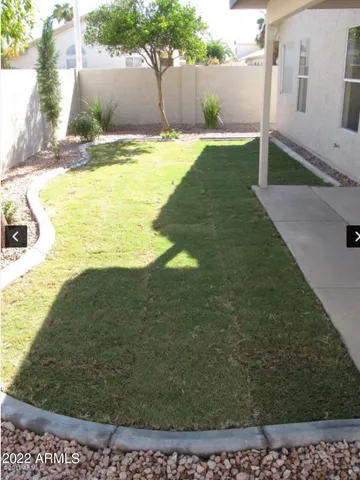 a swimming pool with wooden fence