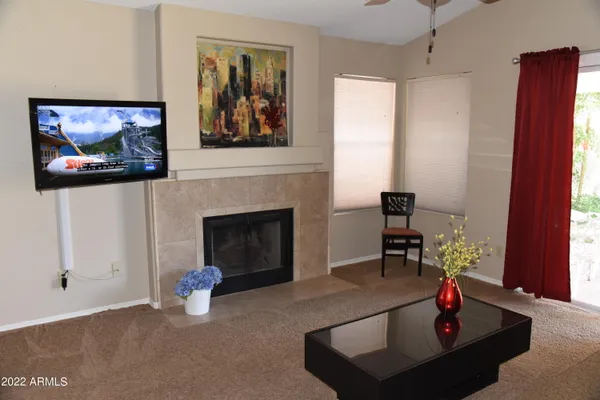 a living room with furniture and a fireplace