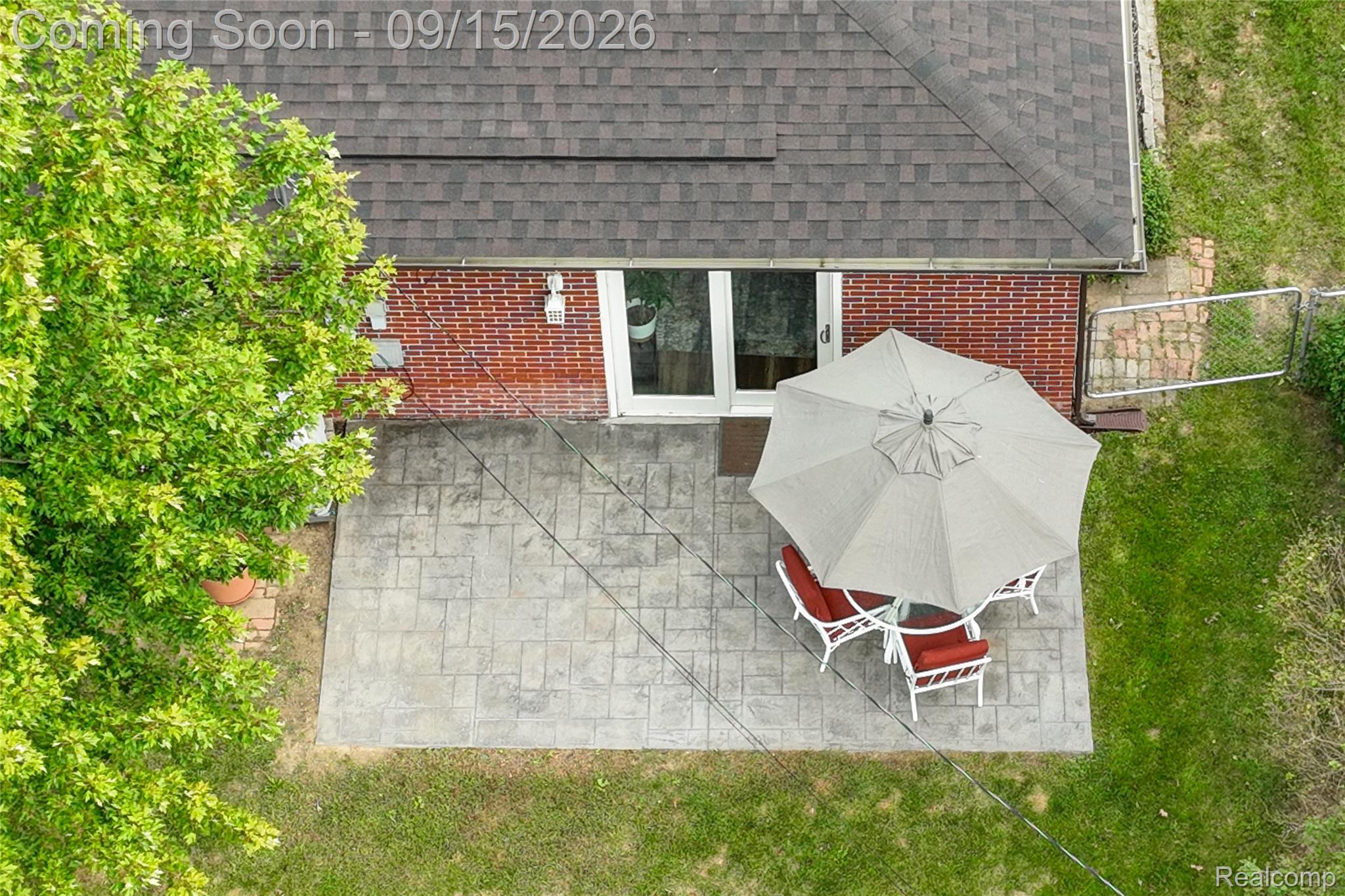 22947 Tuck Road Farmington, MI 48336 - Photo 29 of 34 Brick exterior with a gabled roof and shingle roofing