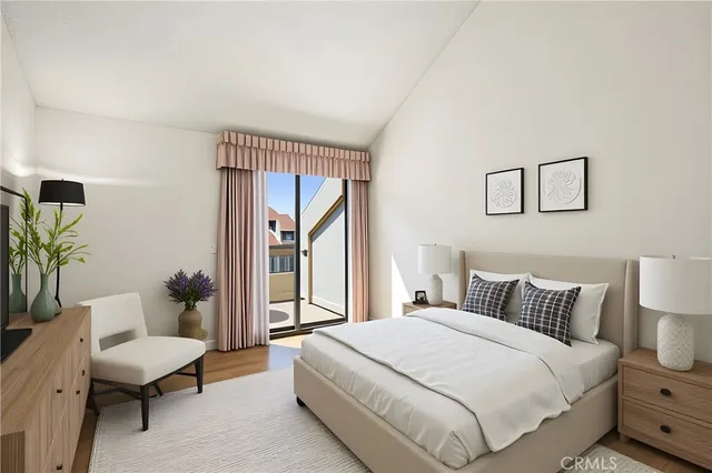 a bedroom with a bed and a couch