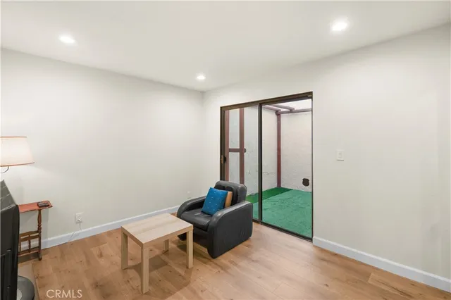 a room with furniture and a wooden floor