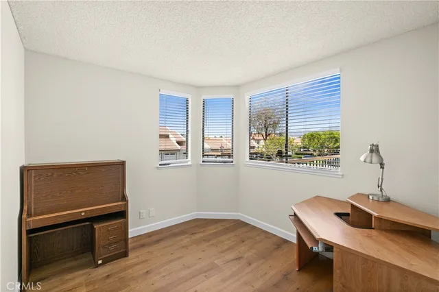 a workspace with furniture and window