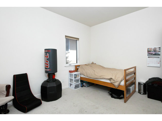 637 Hickey Boulevard Pacifica, CA 94044 - Photo 11 of 15 a bedroom with a bed and a window