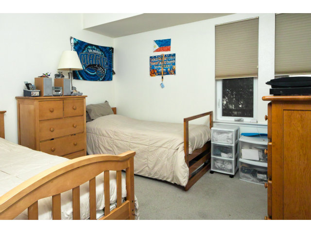 637 Hickey Boulevard Pacifica, CA 94044 - Photo 12 of 15 a bedroom with two beds and a fireplace