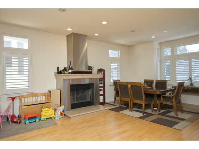 637 Hickey Boulevard Pacifica, CA 94044 - Photo 4 of 15 a living room with furniture a fireplace and a kitchen view