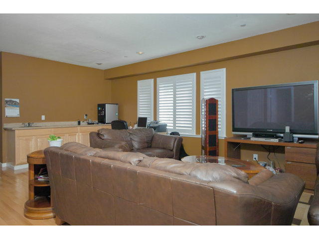 637 Hickey Boulevard Pacifica, CA 94044 - Photo 5 of 15 a living room with furniture and a flat screen tv