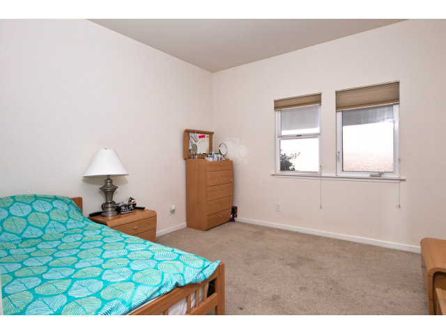 637 Hickey Boulevard Pacifica, CA 94044 - Photo 10 of 15 a bedroom with a bed and a window