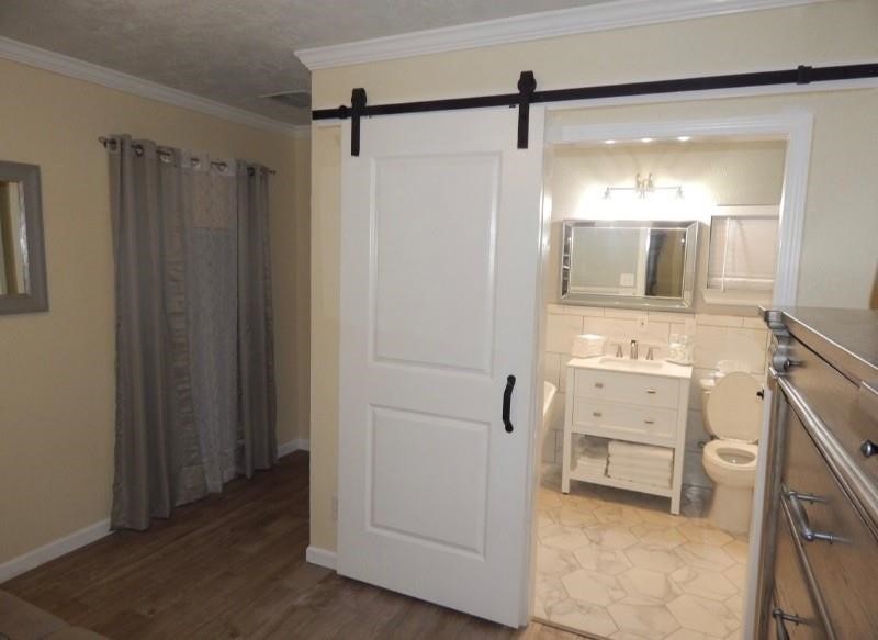 8821 Woodruff Street Houston, TX 77012 - Photo 12 of 20 a bathroom with a shower and a sink