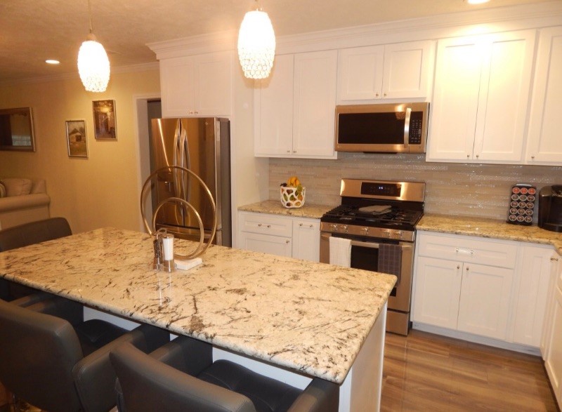 8821 Woodruff Street Houston, TX 77012 - Photo 3 of 20 a kitchen with kitchen island a sink appliances and cabinets